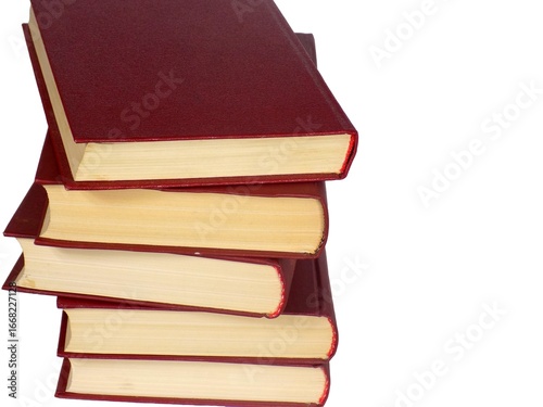 A stack of books with red covers on the table.