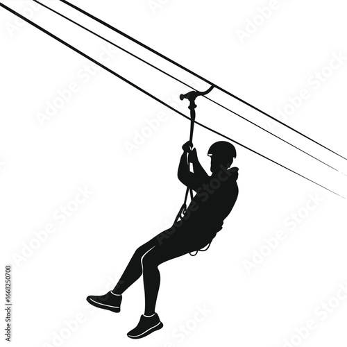 Person ziplining across canyon silhouette