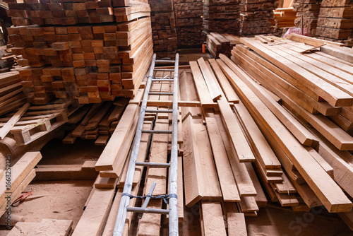 Dusty traditional wood workshop with sawdust pile