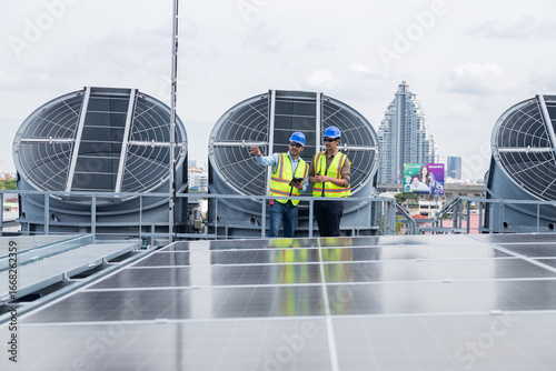 Engineers inspecting rooftop ventilation system installation