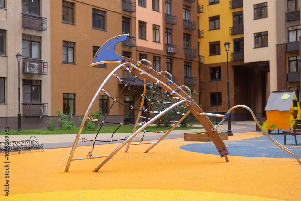 Fototapeta premium Children's playground in the courtyard of of a residential building