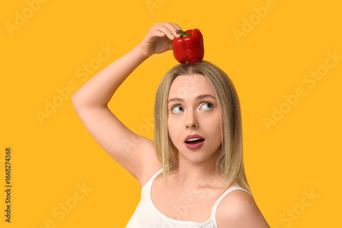 Young woman with bell peppe...