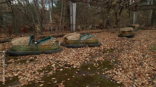 Decayed Autodrome with bumper cars in ghost town Pripyat in radioactive chernobyl exclusion zone