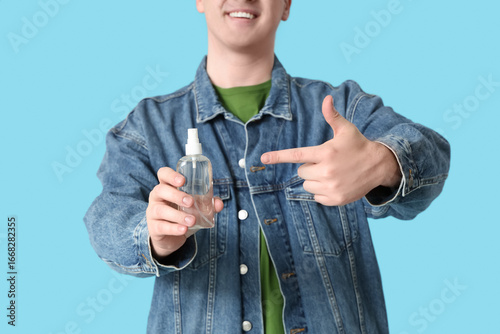 Young man with sanitizer on...