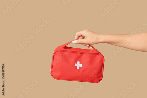Female hand with first aid ...