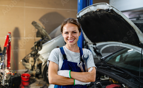 Portrait of smiling female auto mechanic
