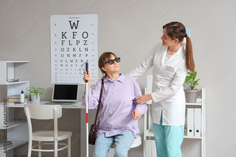 Fototapeta premium Female ophthalmologist with blind woman in clinic