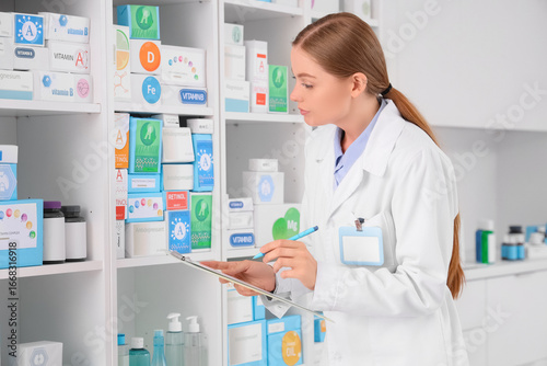 Female pharmacist with clip...