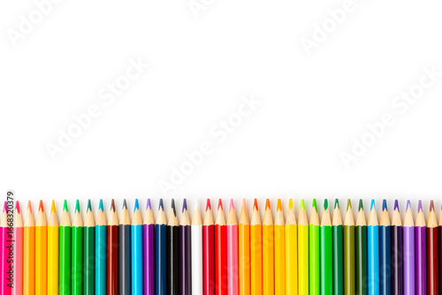 Colored pencils isolated on white background. Equipment for coloring. Stationery for creativity.Back to school. Flatlay. Children's Creativity and Education. Rainbow.