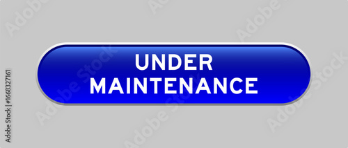 Blue color capsule shape button with word under maintenance on gray background
