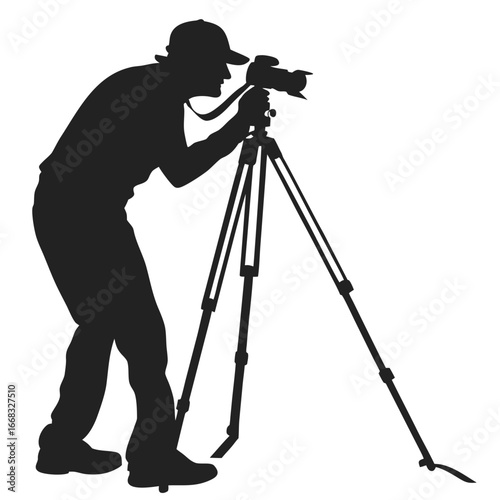 Photographer adjusting tripod silhouette