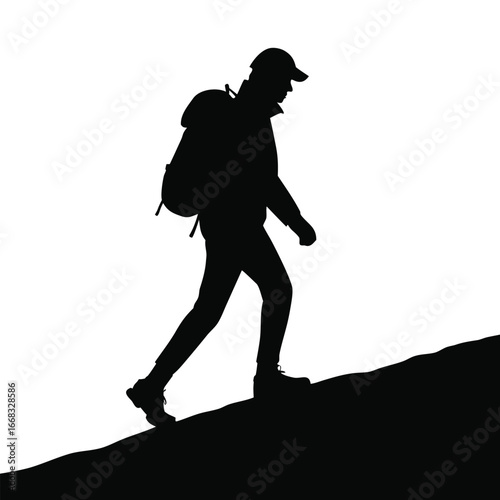Hiker walking along ridge silhouette