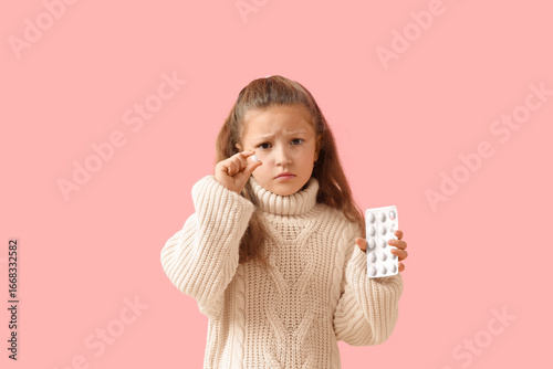 Sick little girl with sore ...