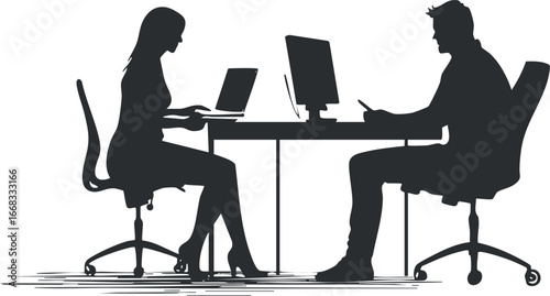 Silhouette of a man and woman sitting at a desk working on computers in an office setting