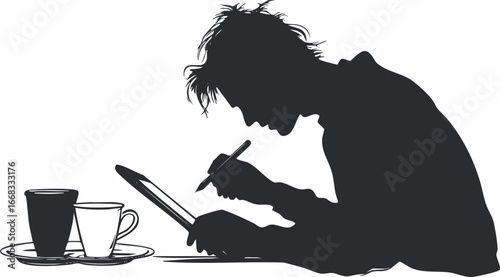 Silhouette of a man drawing on a digital tablet with a stylus while coffee cups sit nearby on the table