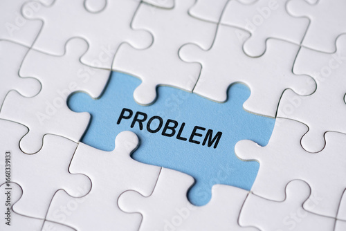Tableau sur toile A single puzzle piece labeled PROBLEM fits into a nearly completed white jigsaw puzzle, symbolizing finding or identifying an issue