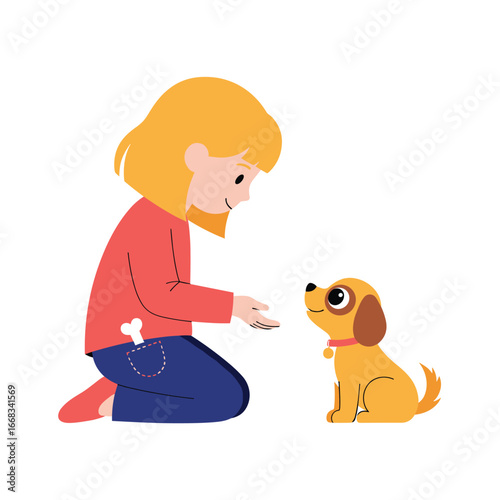 Young child teaching adorable golden puppy sitting on floor with treat in hand showing obedience training techniques