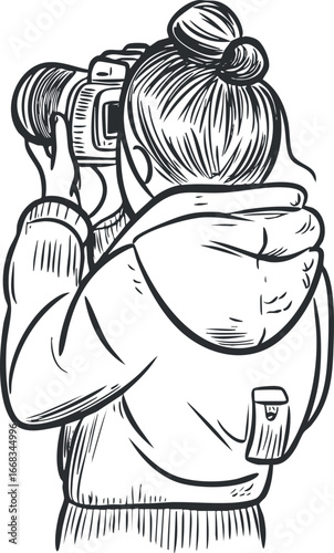 Black and white line art illustration of a woman with a hair bun taking a photo with a digital camera from the back view.