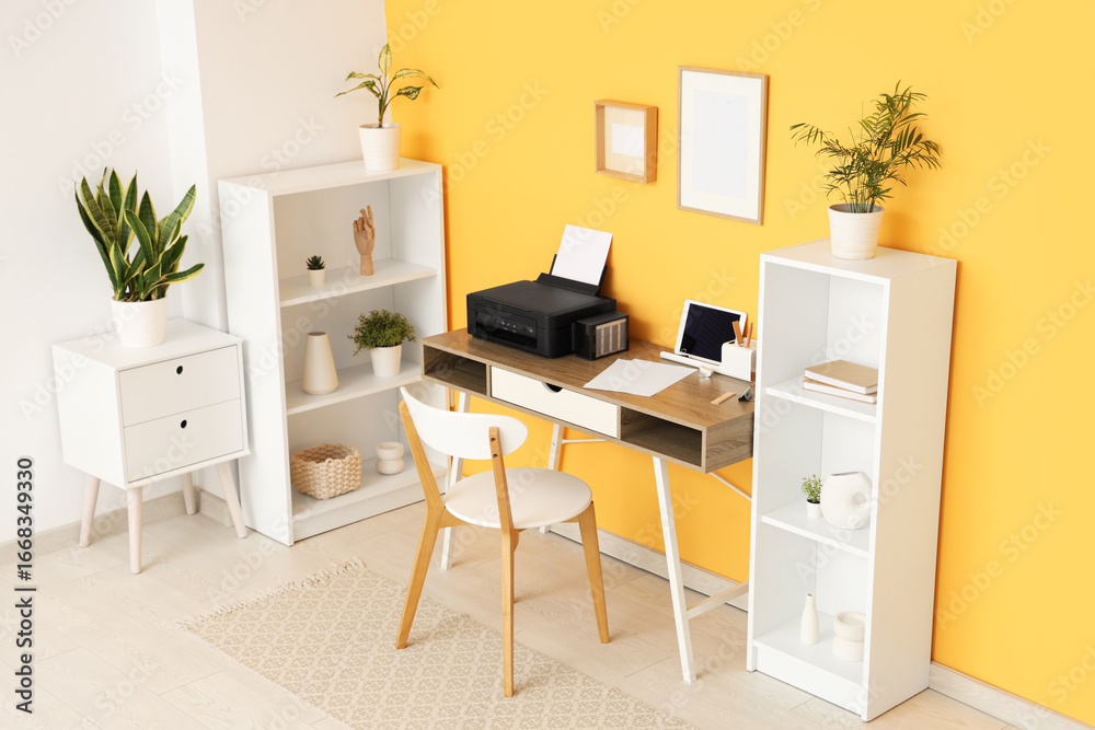 Fototapeta premium Workplace with modern printer and laptop in stylish home office
