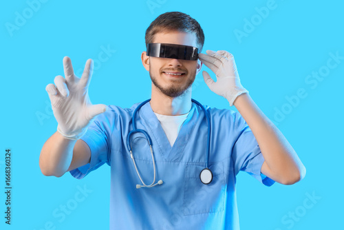 Male doctor in AR glasses u...