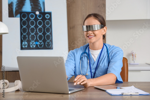 Female doctor in goggles us...