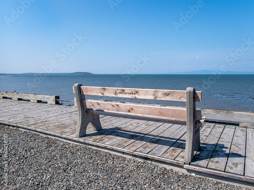 Park bench on the Kamouraska's pier, Quebec, Canada.
