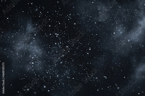 Dark, cosmic scene; countless stars scattered across a nebula-filled, deep-blue expanse