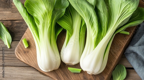 Fresh bok choy on wooden table, organic vegetable ingredient scene