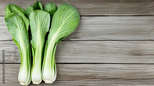 Fresh bok choy on wooden table, organic vegetable ingredient scene