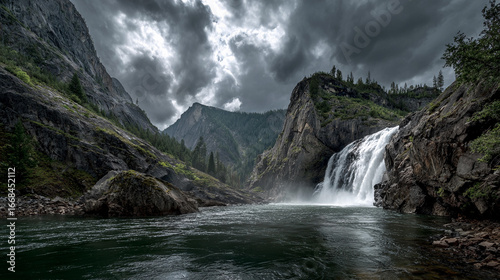 Majestic waterfall cascading in a rugged mountain landscape