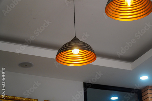Εκτύπωση καμβά Illuminating the space with modern flair, these pendant lights cast a warm, inviting glow