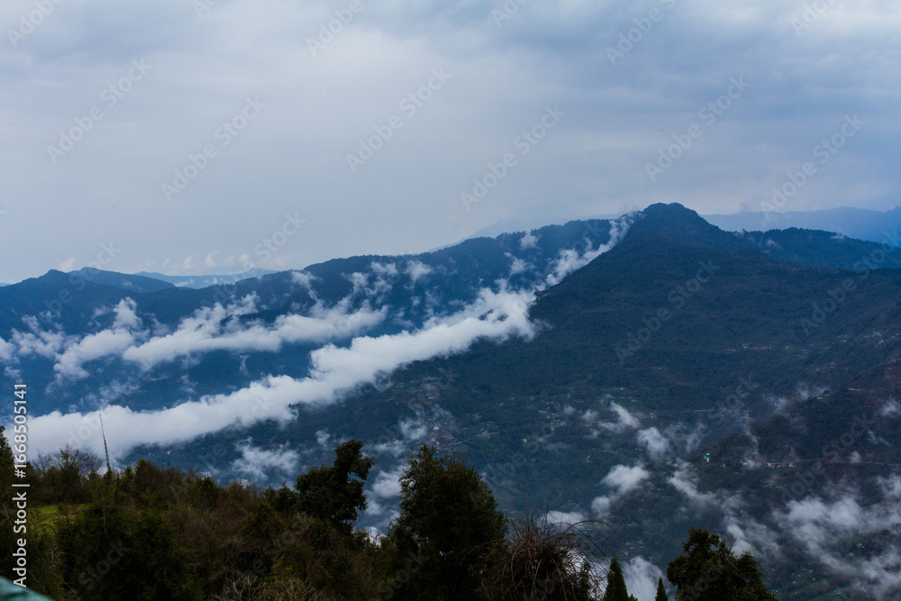 Fototapeta premium Clouds Rolling Over the Eastern Himalayas