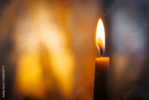 A lit candle in a restuarant