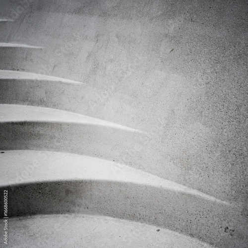 Abstract patterned staircase in light stone ith shards of light