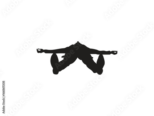 Silhouette of a person balancing on their hands in a yoga pose, conveying strength and mindfulness.