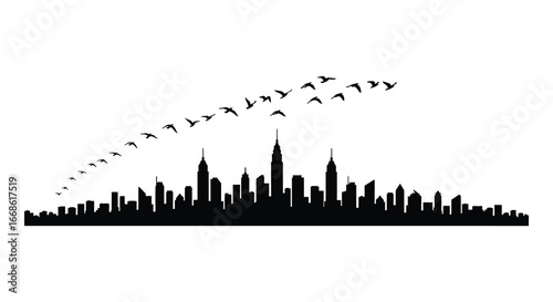 City skyline at dusk with birds flying overhead in formation silhouette