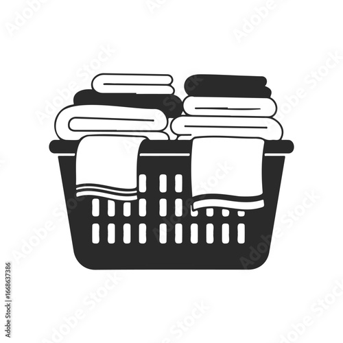 Black and white laundry basket filled with folded towels