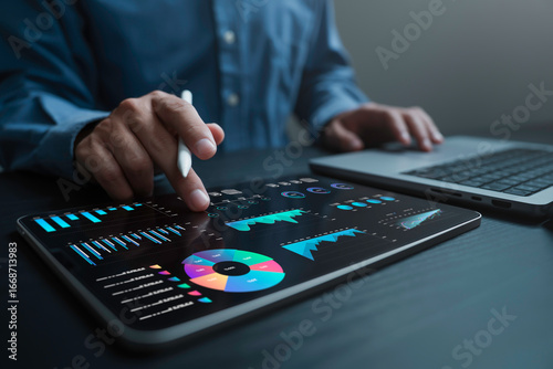 An analyst uses a computer and dashboard for data business analysis and Data Management System with KPI and metrics connected to the database for technology finance, operations, sales, marketing