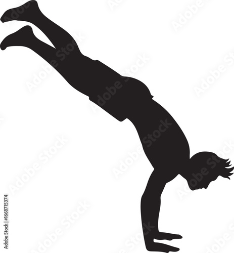 Silhouette of a man performing a handstand with legs extended upwards