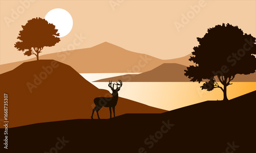 Deer Standing in the afternoon with mountains and lake in the background