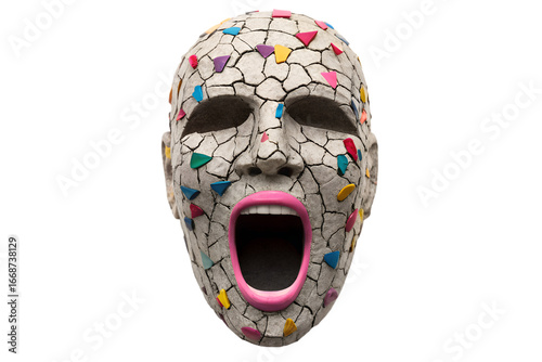 A striking, deeply textured cracked face mask, adorned with vibrant mosaic fragments, portraying a powerful open-mouthed expression of intense human emotion