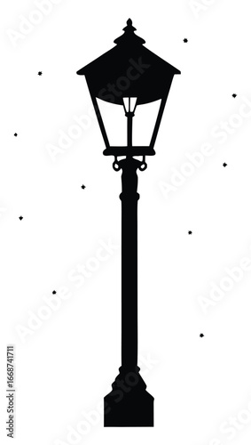 Elegant Silhouette of a Street Lamp Under a Light Snowfall