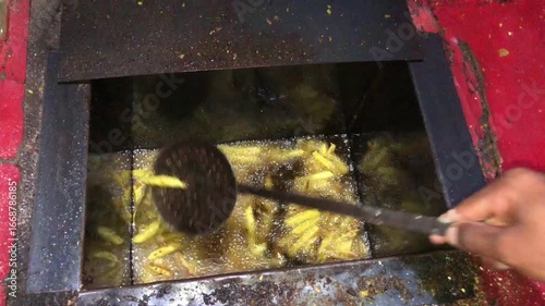 Frying plantain chips in oil