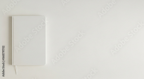 Minimalist white notebook with bookmark ready for your creative concepts and professional ideas today