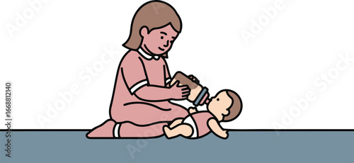 Young girl in a pink dress kneeling on the floor while bottle-feeding her baby doll.