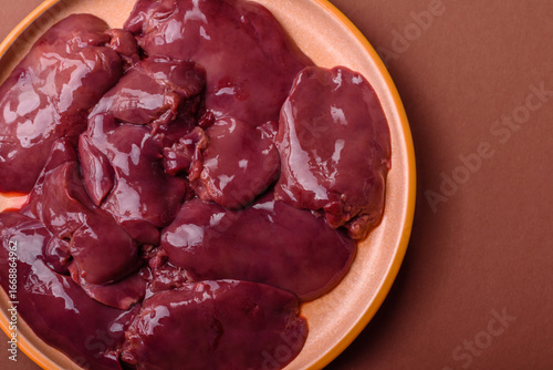Canvas Print Raw fresh chicken or turkey liver, internal offal of poultry