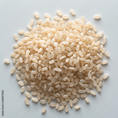 Pile of brown rice grains isolated on white background