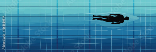 A silhouette of a person swimming in a blue swimming pool with lane lines visible from above the water
