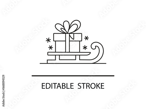 Festive gift on a sleigh with snowflakes, celebrating holiday cheer and winter wonder.