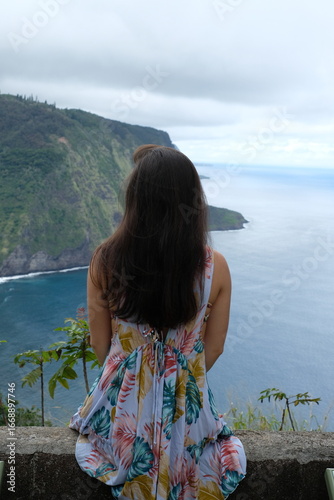 Woman Sitting in Hawaii Overlooking Ocean 